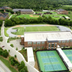 areal view of Ensworth building with tennis court and soccer field