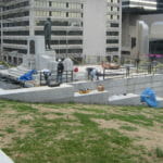 masonry workers building the Legislative Plaza