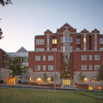 UT Haslam College of Business Building with setting sun